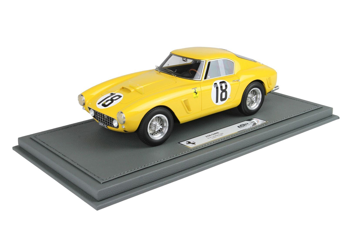Yellow Ferrari 250 SWB model car with racing number 18 on gray display base, available via Vroomi
