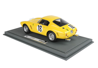 Yellow Ferrari 250 SWB model car with number 18 on gray display base, now available on Vroomi