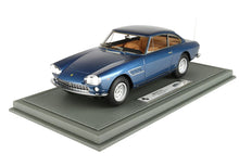 Blue Ferrari 330 GT 2+2 model car with tan interior on display base, available through Vroomi