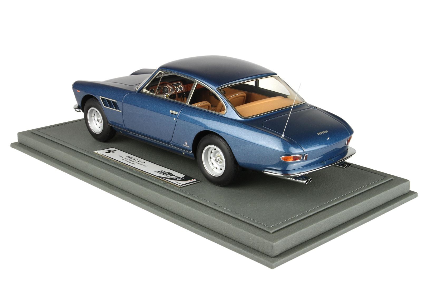 Blue Ferrari 330 GT 2+2 model car on gray base with tan interior, available on Vroomi