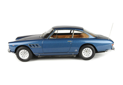 Blue vintage sports car with tan interior and white rims available now on Vroomi