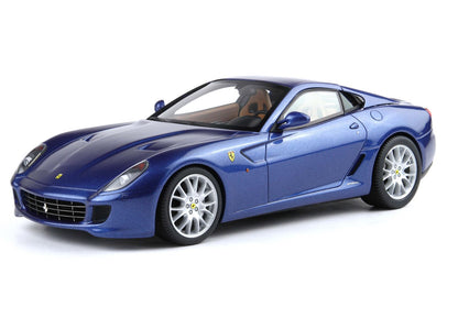 Blue Ferrari sports car model with silver wheels and tan interior, available on Vroomi platform