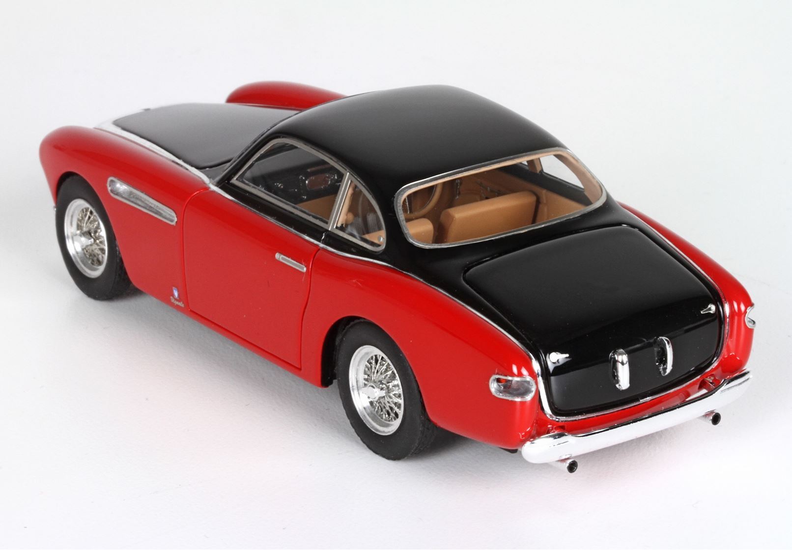 Red and black classic model car with tan interior and chrome wheels, available on Vroomi