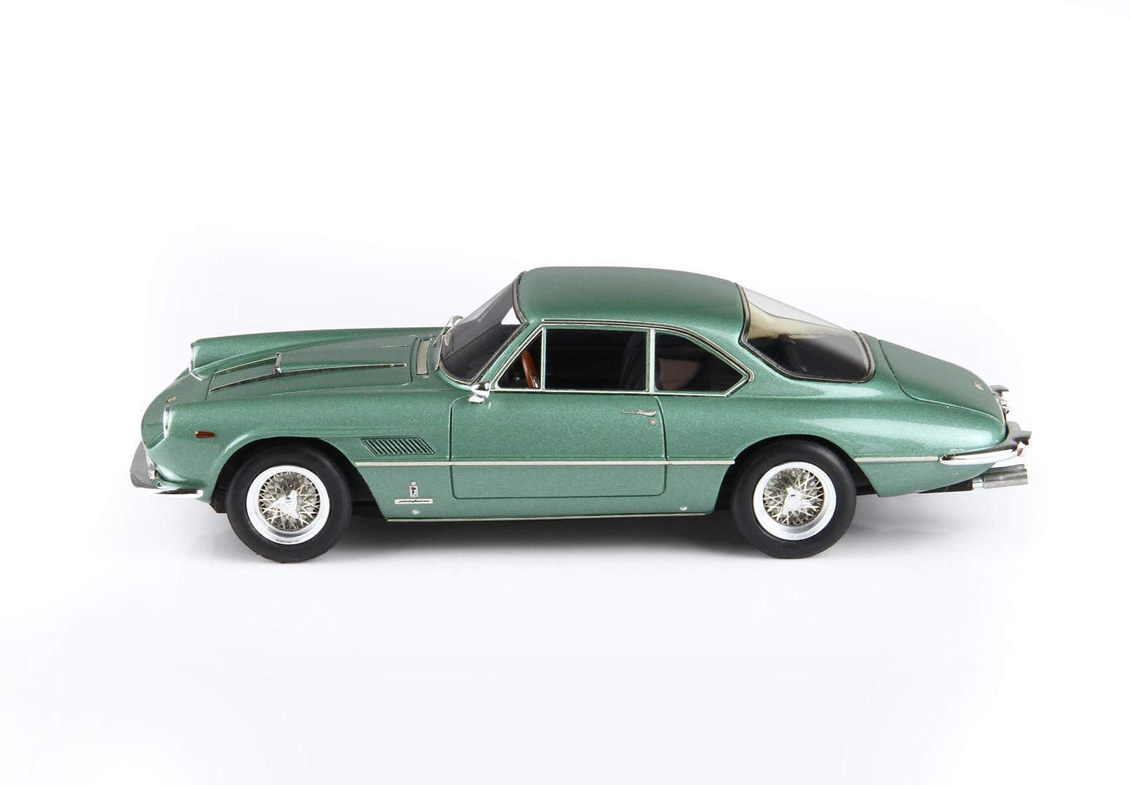 Green vintage classic sports car model with wire wheels, available through Vroomi platform