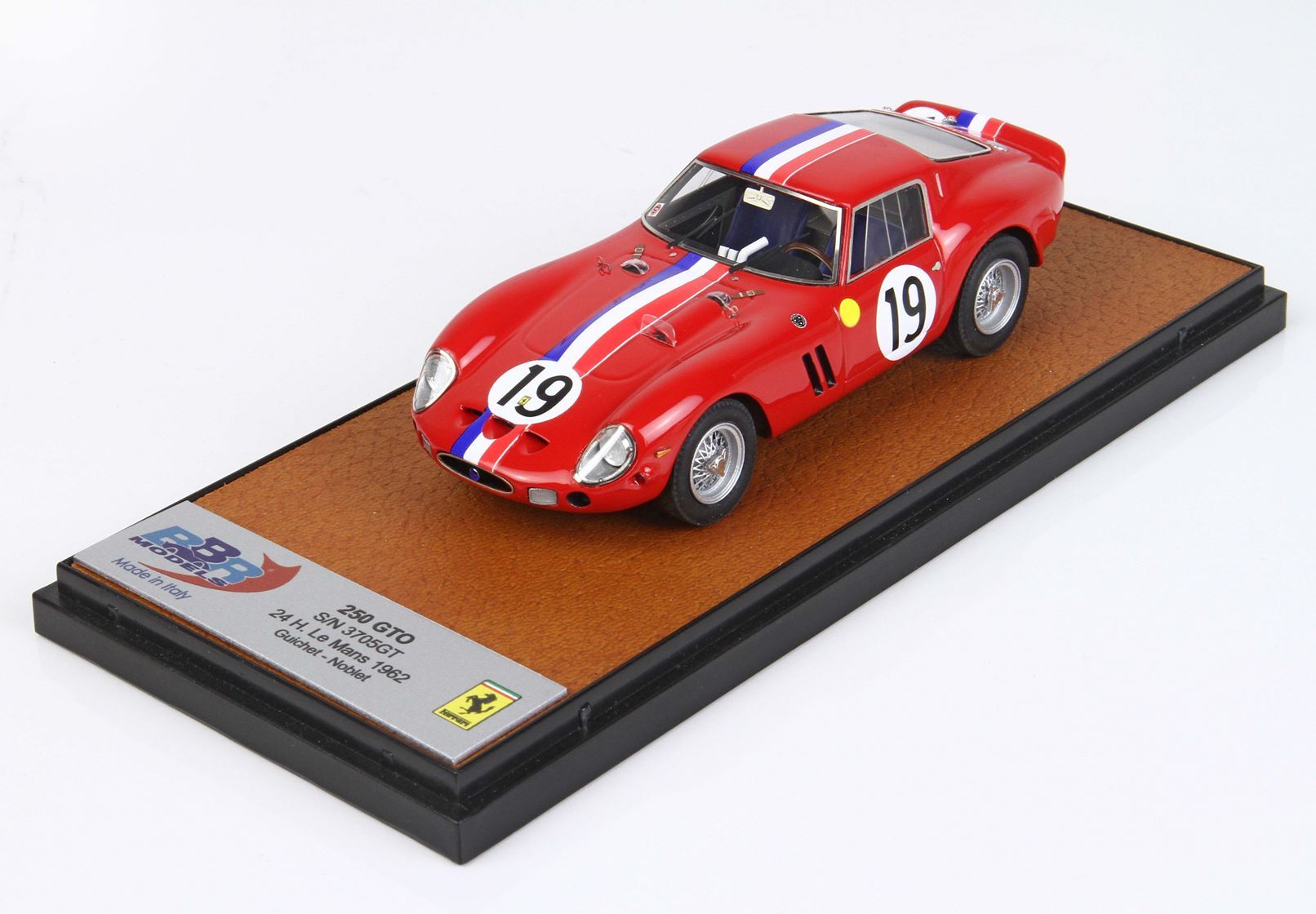Red Ferrari 250 GTO model car with number 19 on display base, available via Vroomi