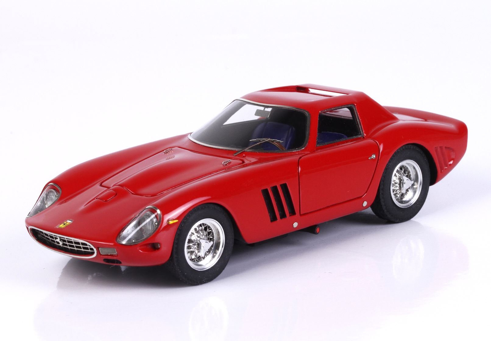 Red vintage Ferrari model car with sleek design, detailed wheels, and tinted windows, also offered on Vroomi
