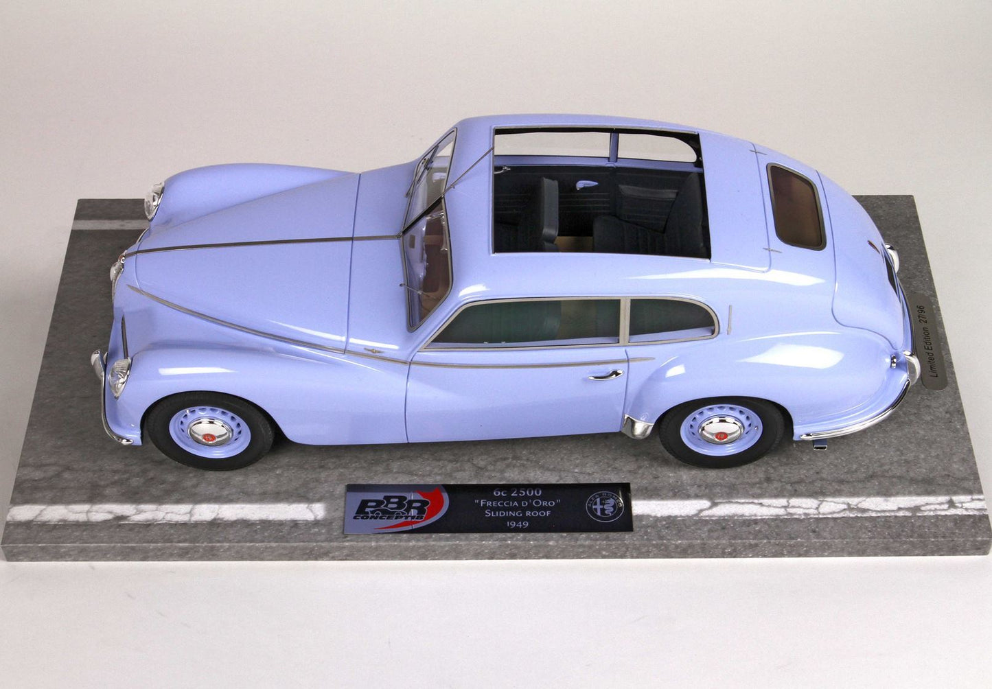 Light blue 1949 Alfa Romeo 6C 2500 Freccia D'Oro model car with sliding roof on display base, available on Vroomi