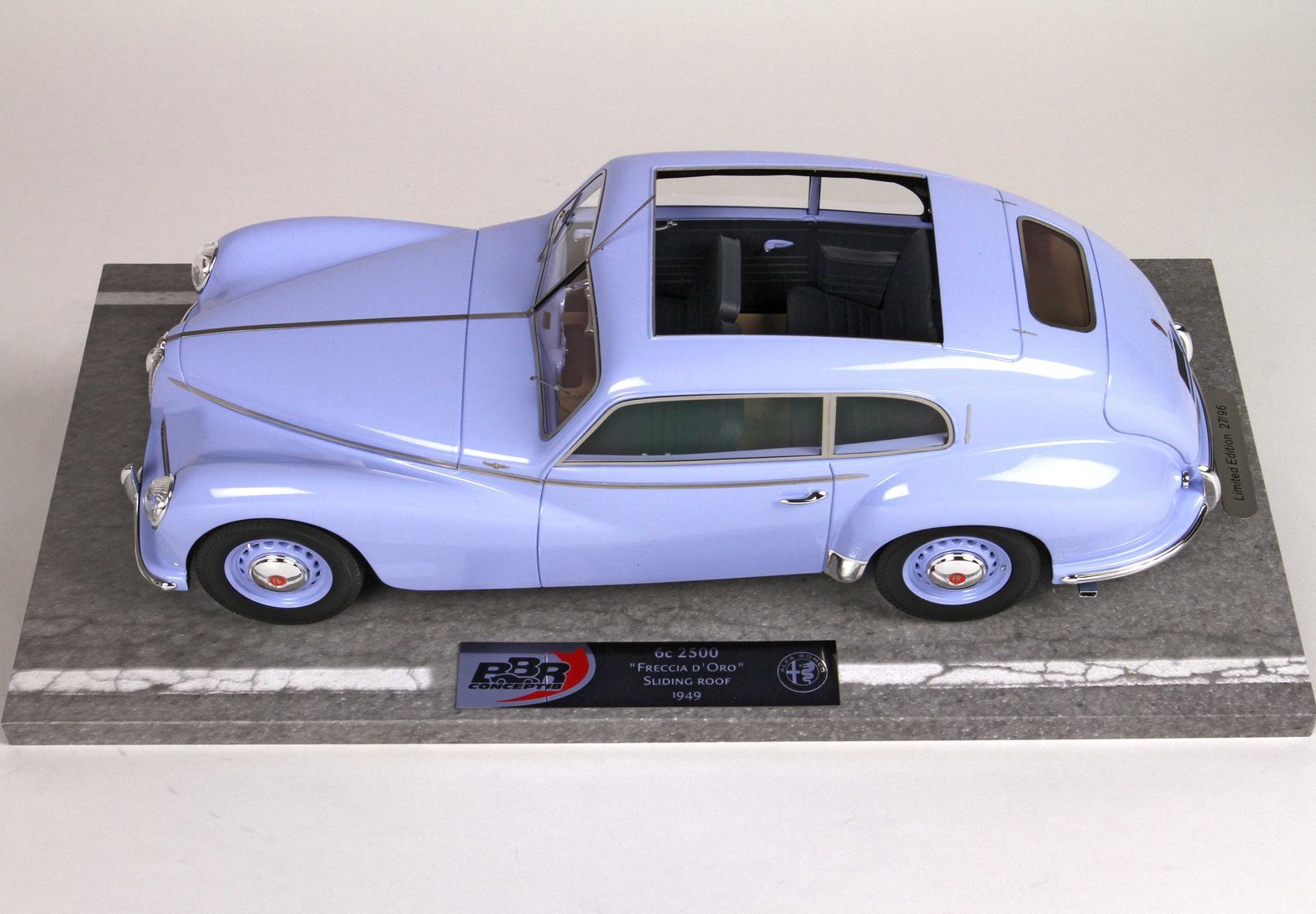Light blue 1949 Alfa Romeo 6C 2500 Freccia D'Oro model car with sliding roof on display base, available on Vroomi