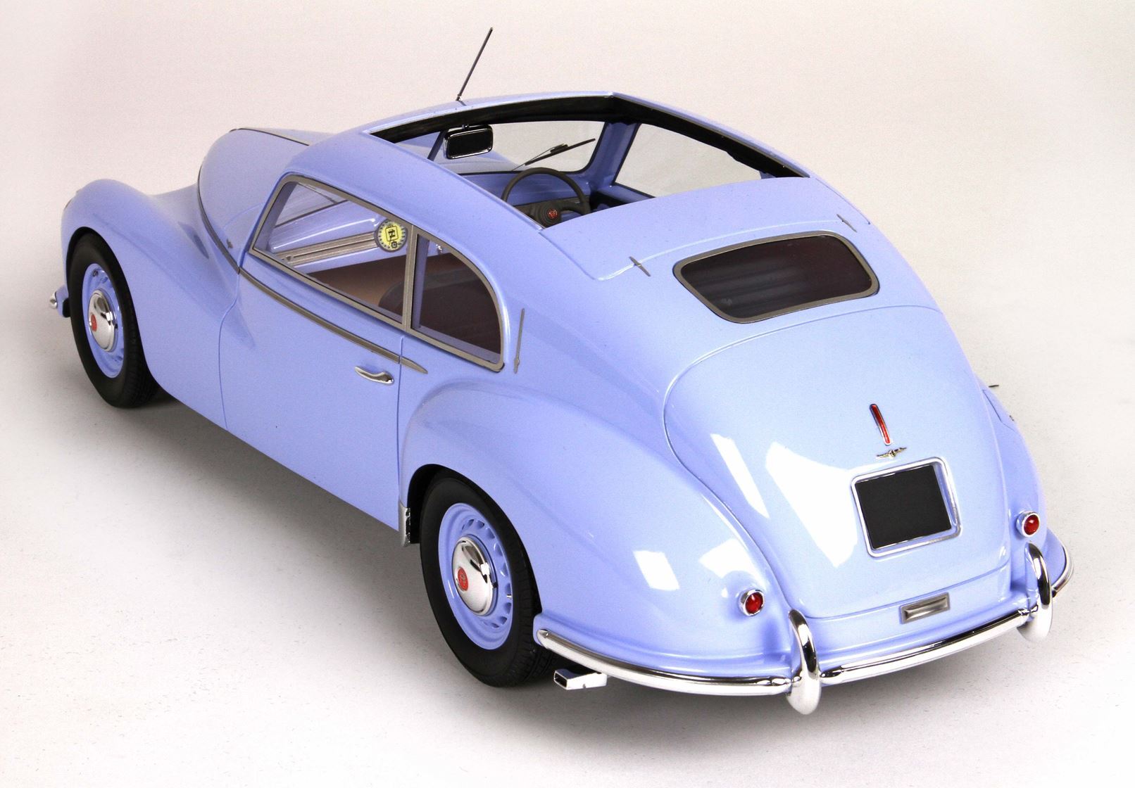 Light blue vintage classic car model with sunroof and chrome details, purchasable on Vroomi platform