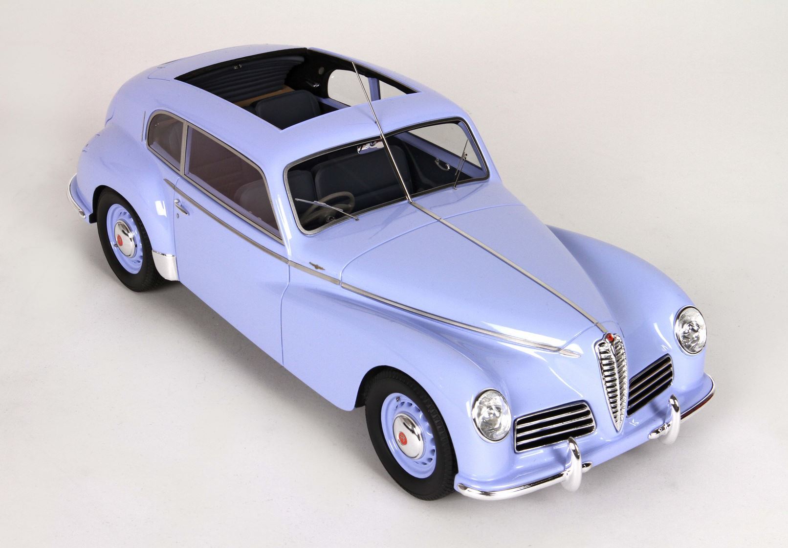 Light blue vintage Alfa Romeo classic car model with open sunroof, featured on Vroomi platform