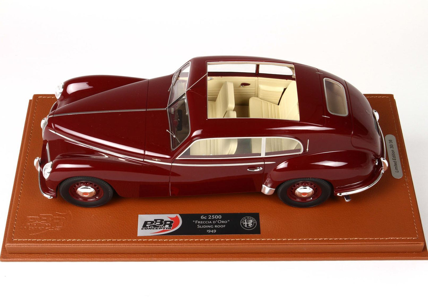 Maroon 1949 Alfa Romeo 6c 2500 model car with sliding roof on leather base, available on Vroomi