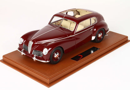 Maroon classic Alfa Romeo model car with cream interior on a stitched brown display base available on Vroomi