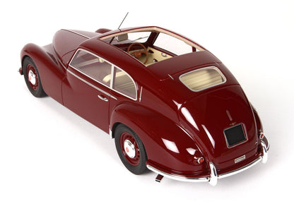 Glossy maroon vintage classic car model with beige interior, showcased with Vroomi availability
