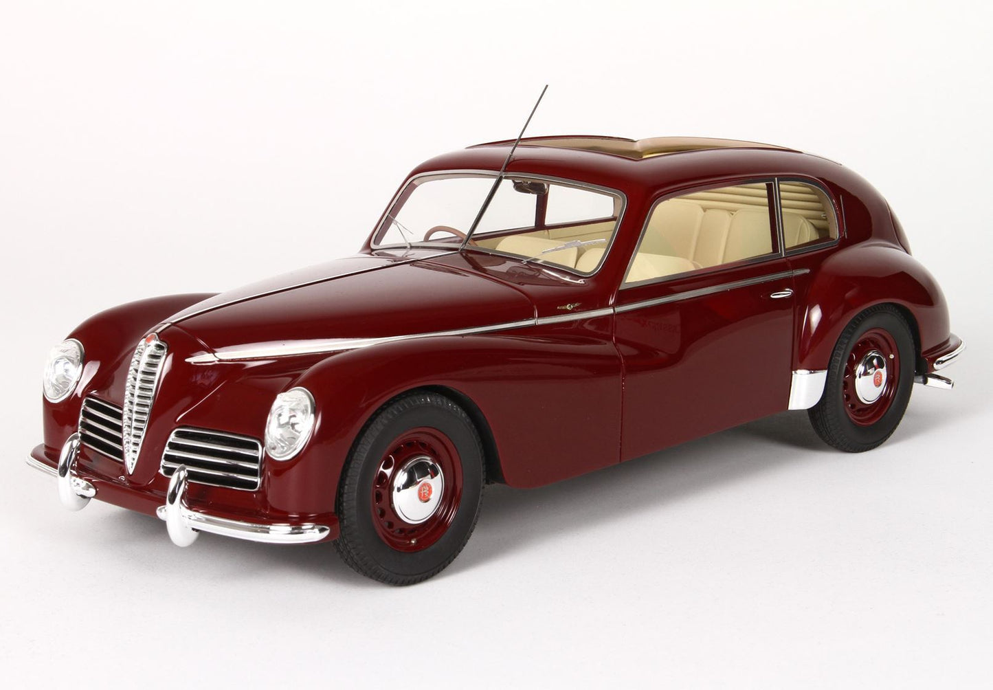 Classic red vintage Alfa Romeo car model with beige interior, available through Vroomi platform