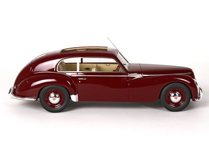 Side view of vintage maroon classic car with beige interior, showcased and available on Vroomi platform