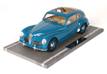 Blue classic Alfa Romeo model car displayed on a grey platform, available now through Vroomi