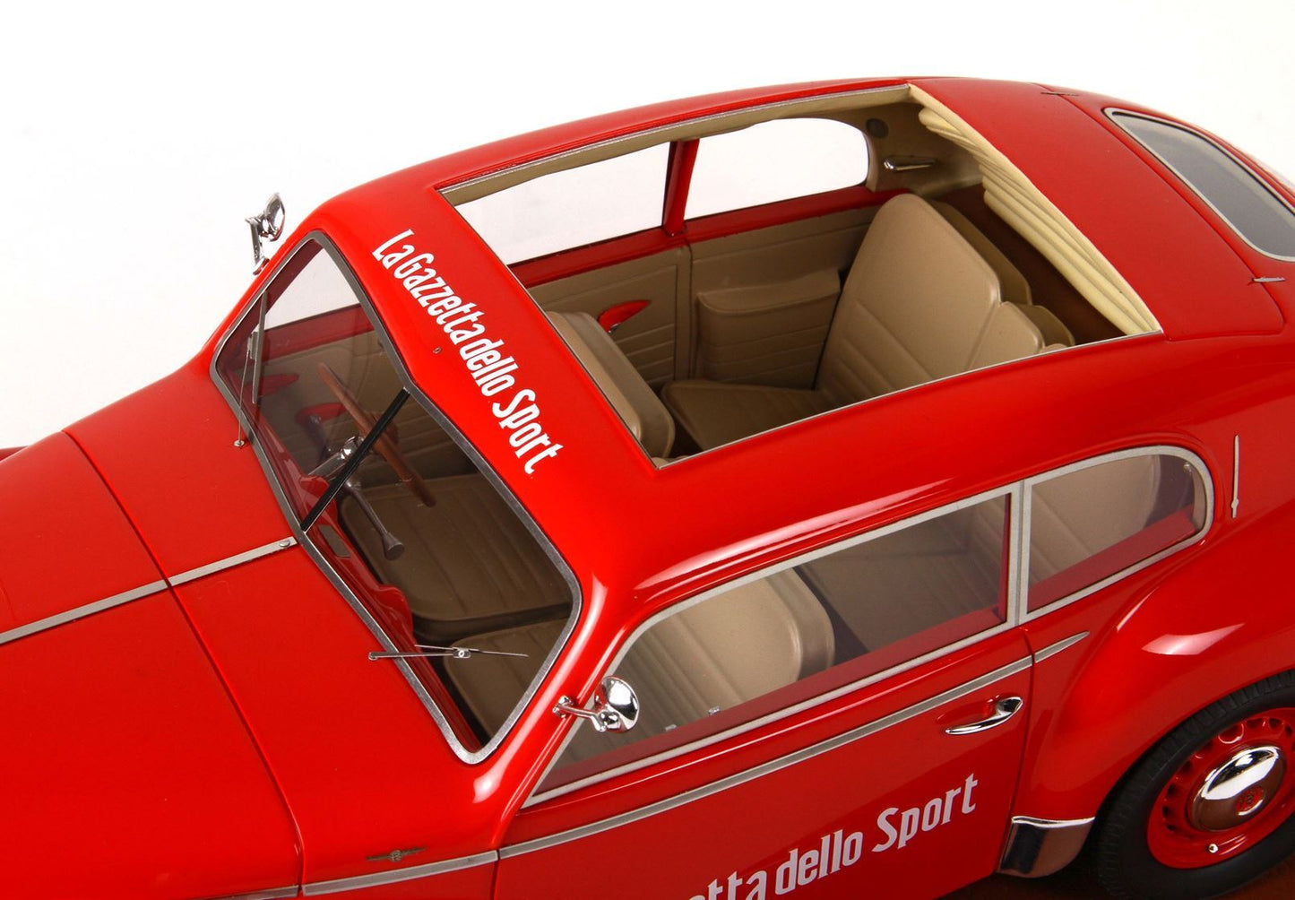 Red vintage car model with sunroof and beige interior, La Gazzetta dello Sport decal, available on Vroomi