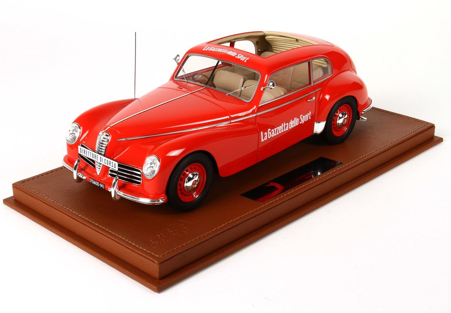 Red vintage Alfa Romeo model car with La Gazzetta dello Sport logo, displayed on a brown base, available on Vroomi