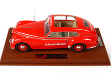 Red vintage La Gazzetta dello Sport model car with sliding roof on brown base, offered on Vroomi