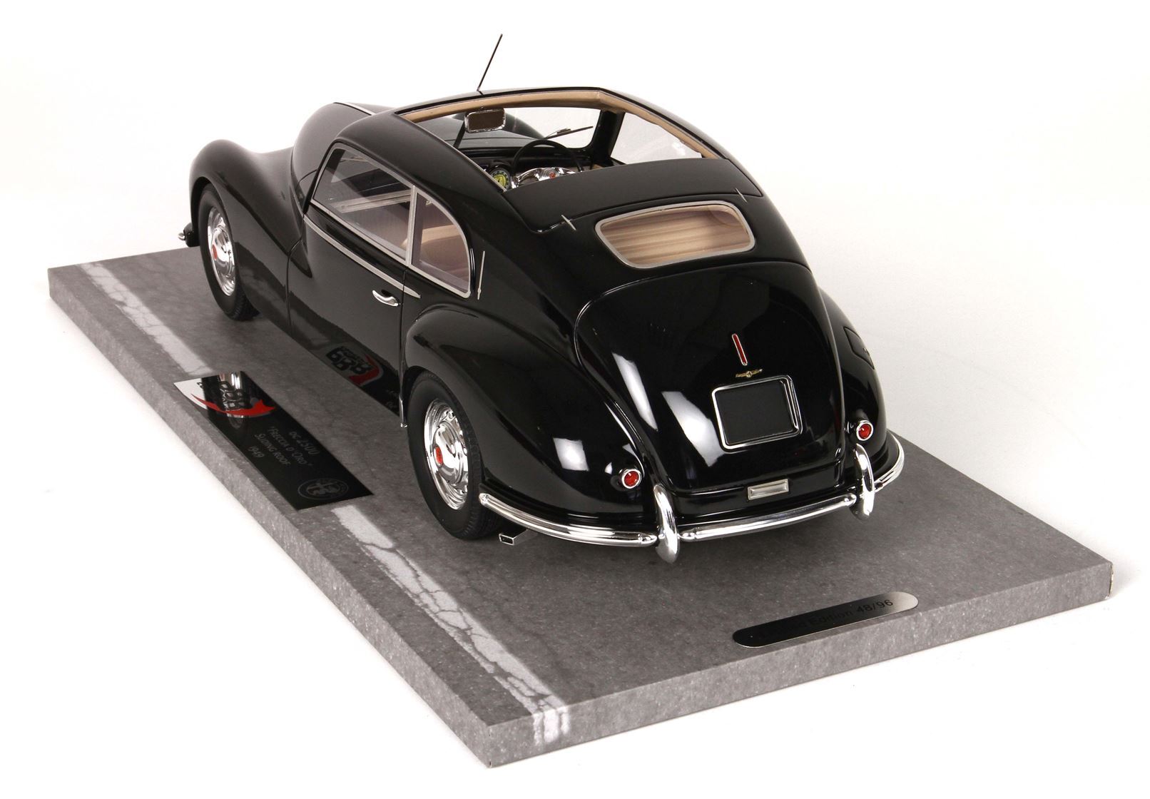 Black vintage Alfa Romeo model car on display base with chrome details, offered on Vroomi