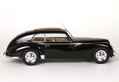 Classic black vintage car model with beige interior and chrome hubcaps, offered on Vroomi