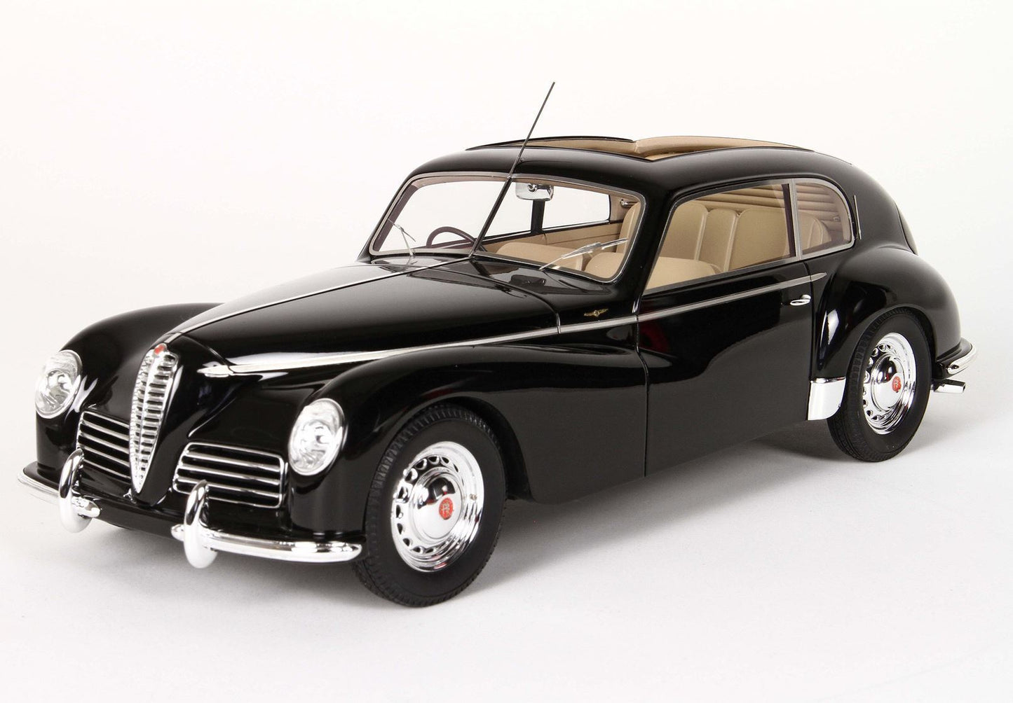 Black vintage Alfa Romeo model car with chrome grille and beige interior, now offered on Vroomi
