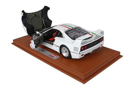 White Kyosho Ferrari F40 model car with open doors on brown display base, sold through Vroomi