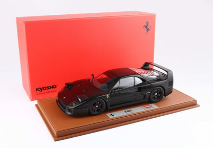 Matte black Ferrari F40 model car on leather base with red Kyosho box, available on Vroomi