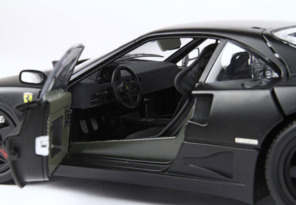 Open driver door of black Ferrari F40 showing carbon fiber interior and racing seats, available on Vroomi