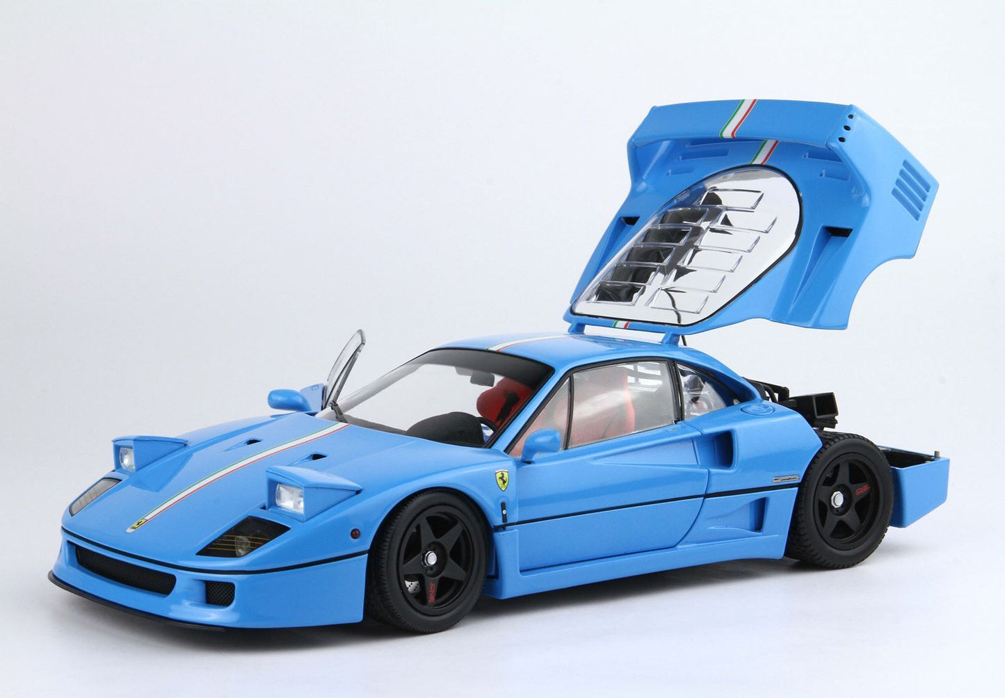 Blue Ferrari F40 model car with open rear hood and doors, featuring Italian stripe, available on Vroomi