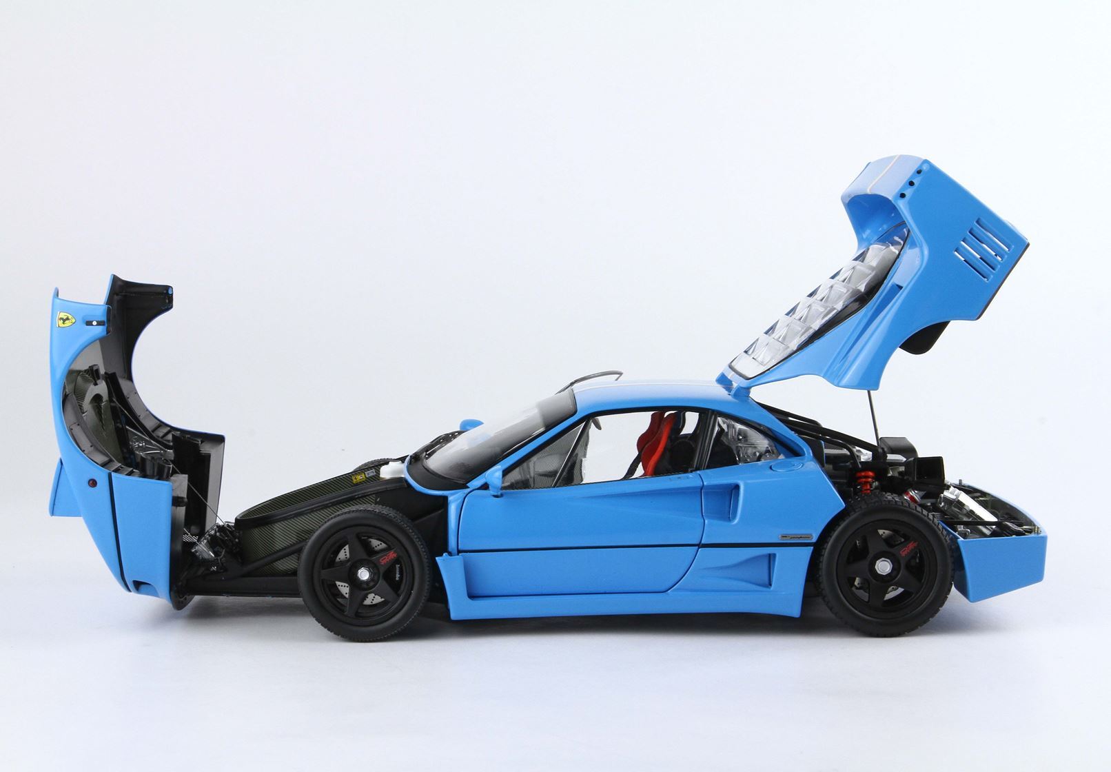 Blue Ferrari F40 model car with open front and rear hoods, detailed interior and engine, available on Vroomi