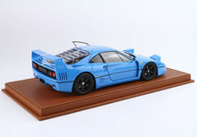 Blue Ferrari F40 model car on brown display base, available for purchase on Vroomi
