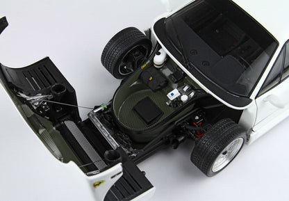 Open front trunk of white sports car showing detailed storage and spare tire, also available on Vroomi