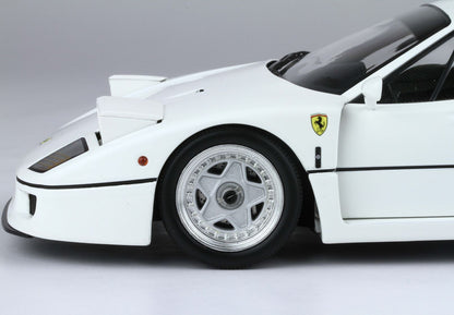 Close-up of white Ferrari F40 front wheel and badge, detailed model car available on Vroomi