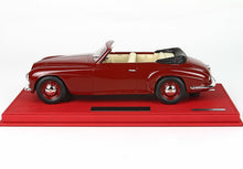 Classic red convertible model car with cream interior on red display base, available on Vroomi