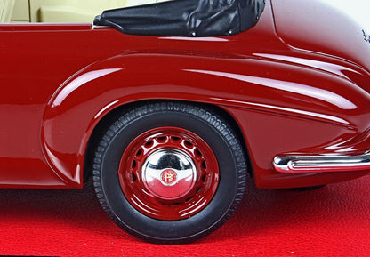 Close-up of glossy red vintage Alfa Romeo car wheel and fender, available on Vroomi