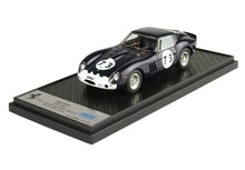 Detailed model of a black and white Ferrari 250 GTO race car with number 73, displayed on a textured stand, offered on Vroomi