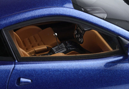 Blue sports car interior with tan leather seats and manual gear shift available on Vroomi