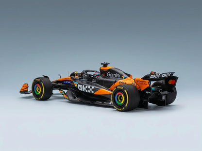 Orange and black Formula 1 scale model car with rainbow rims, featured at Vroomi for collectors.
