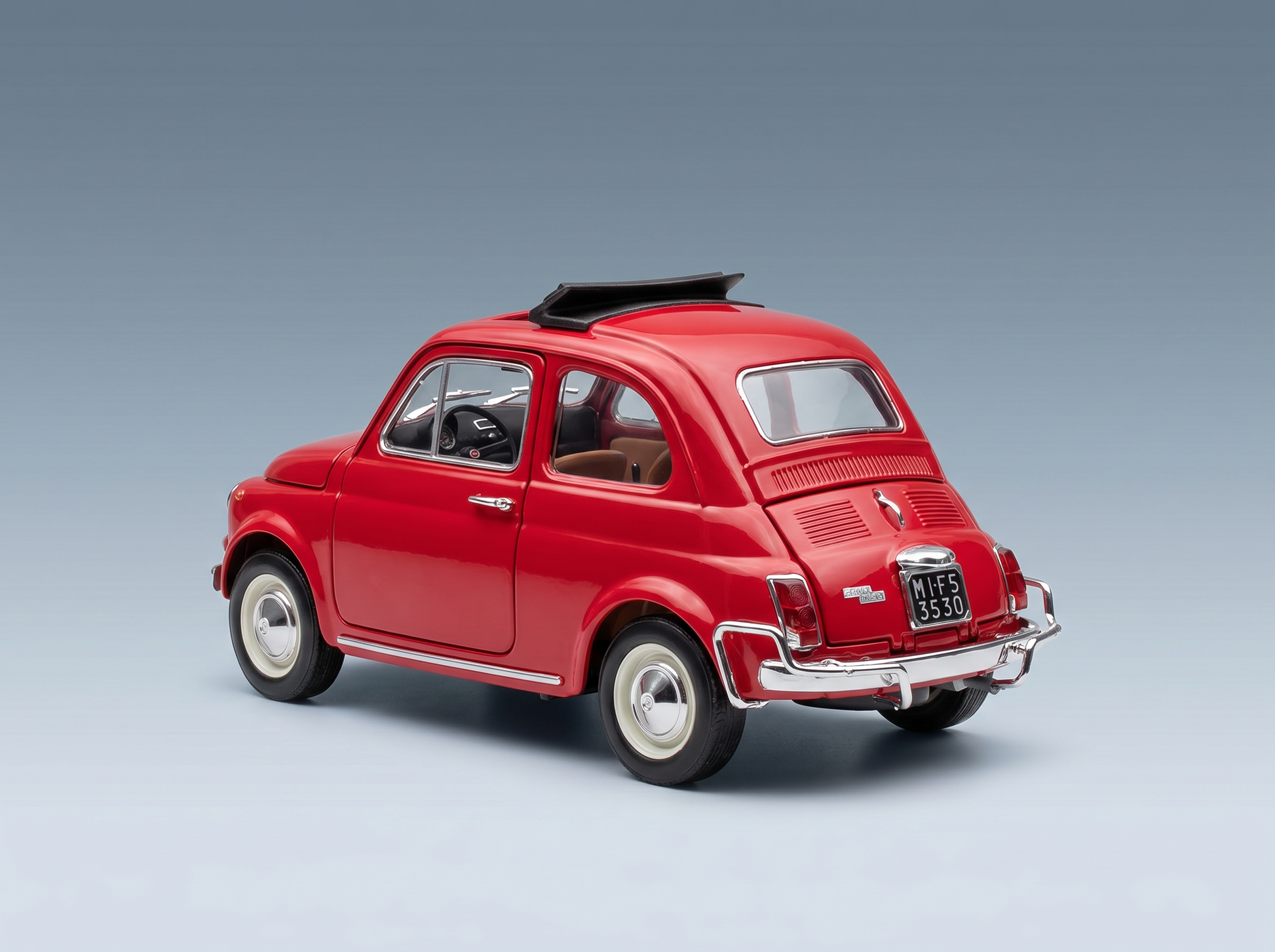 Red classic Fiat 500 scale model car with black roof, white-wall tires, and chrome details — Vroomi