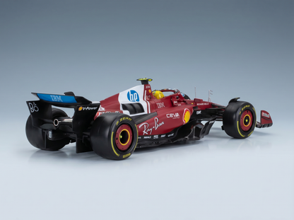 Red and white scale model car with sponsor logos, showcased at Vroomi for collectors.