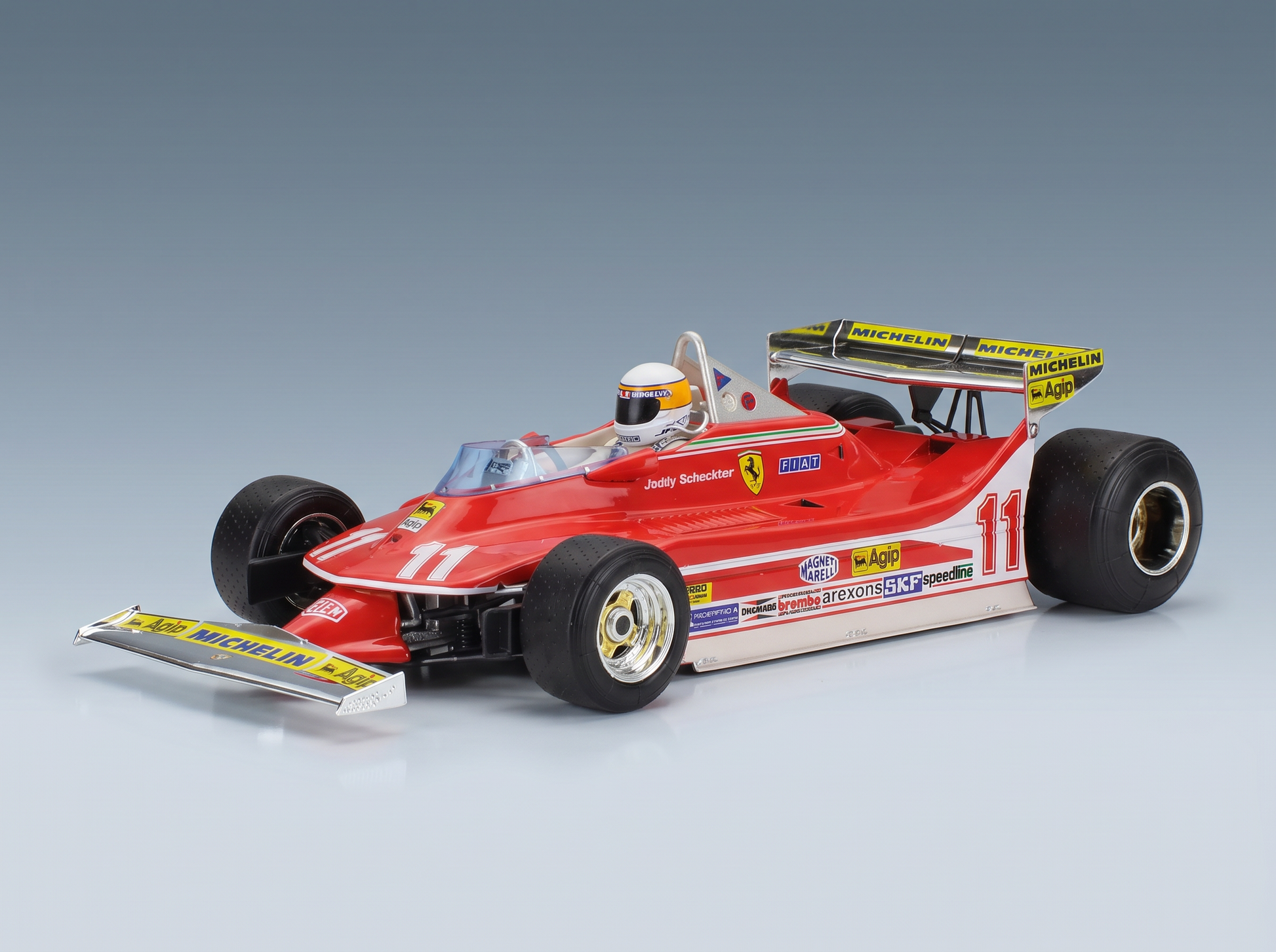 Red Ferrari F1 scale model car with Jody Scheckter livery, detailed sponsor decals, at Vroomi