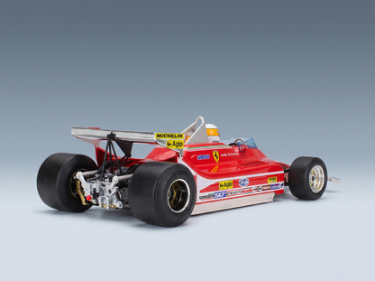 Red Ferrari F1 scale model car with sponsor decals, displayed by Vroomi for collectors