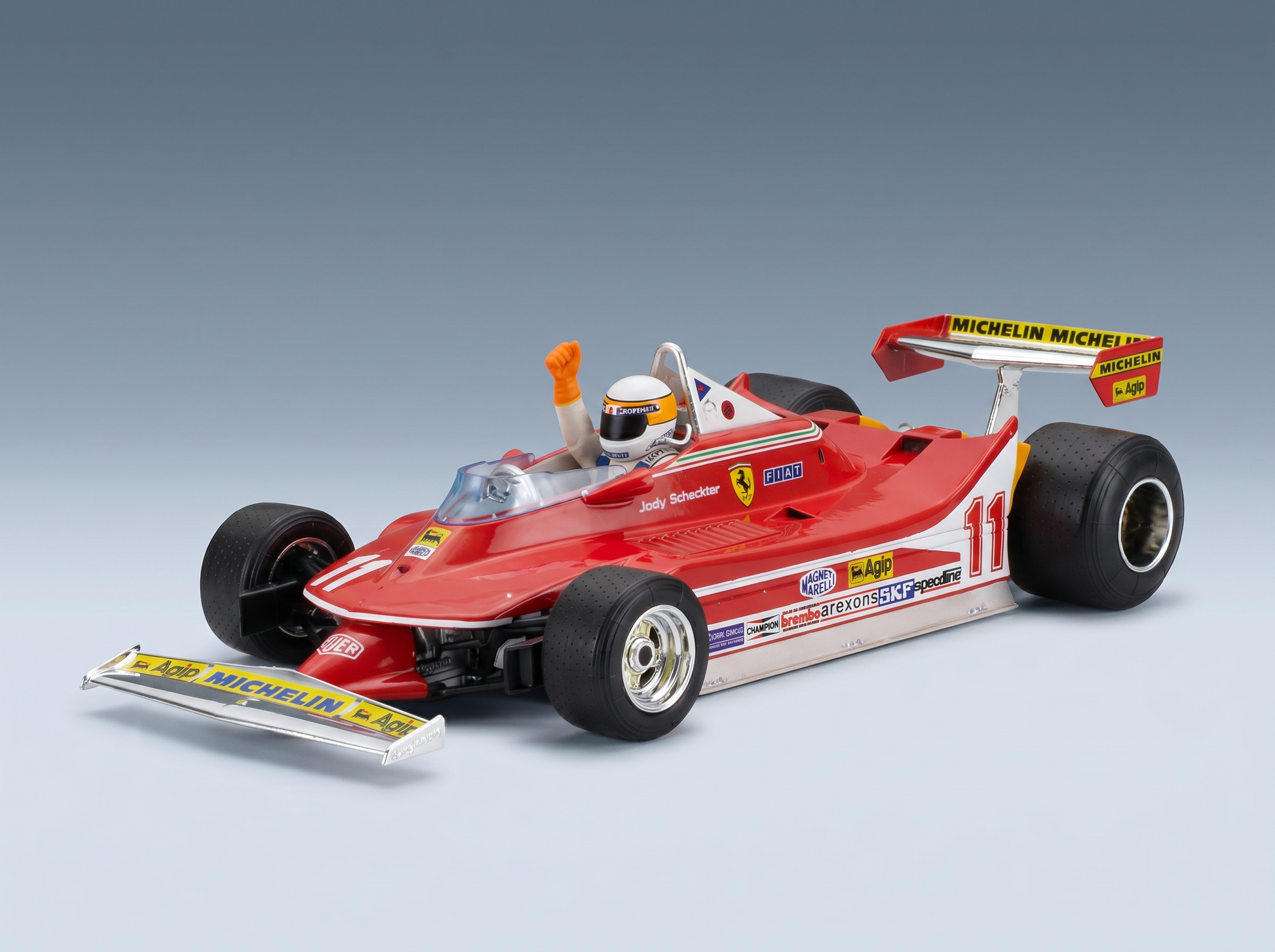 Rotes Ferrari-F1-Modellauto mit Jody Scheckter und detaillierten Sponsoren-Aufklebern von Vroomi