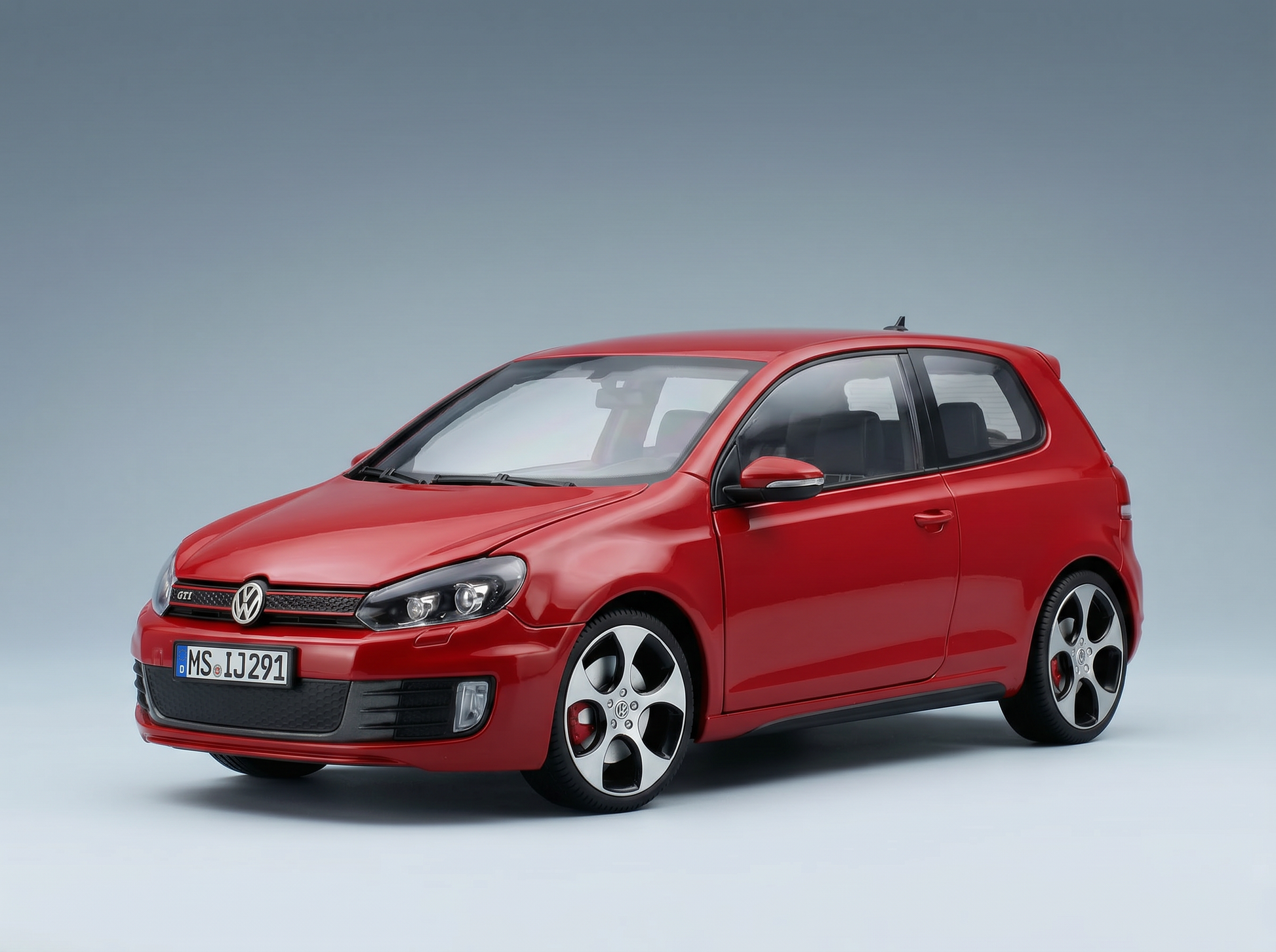 Maqueta a escala de un Volkswagen Golf GTI rojo de Vroomi, réplica detallada de fundición a presión con llantas de aleación