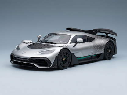 Silver Mercedes-AMG ONE scale model car with green accents, showcased by Vroomi for collectors.