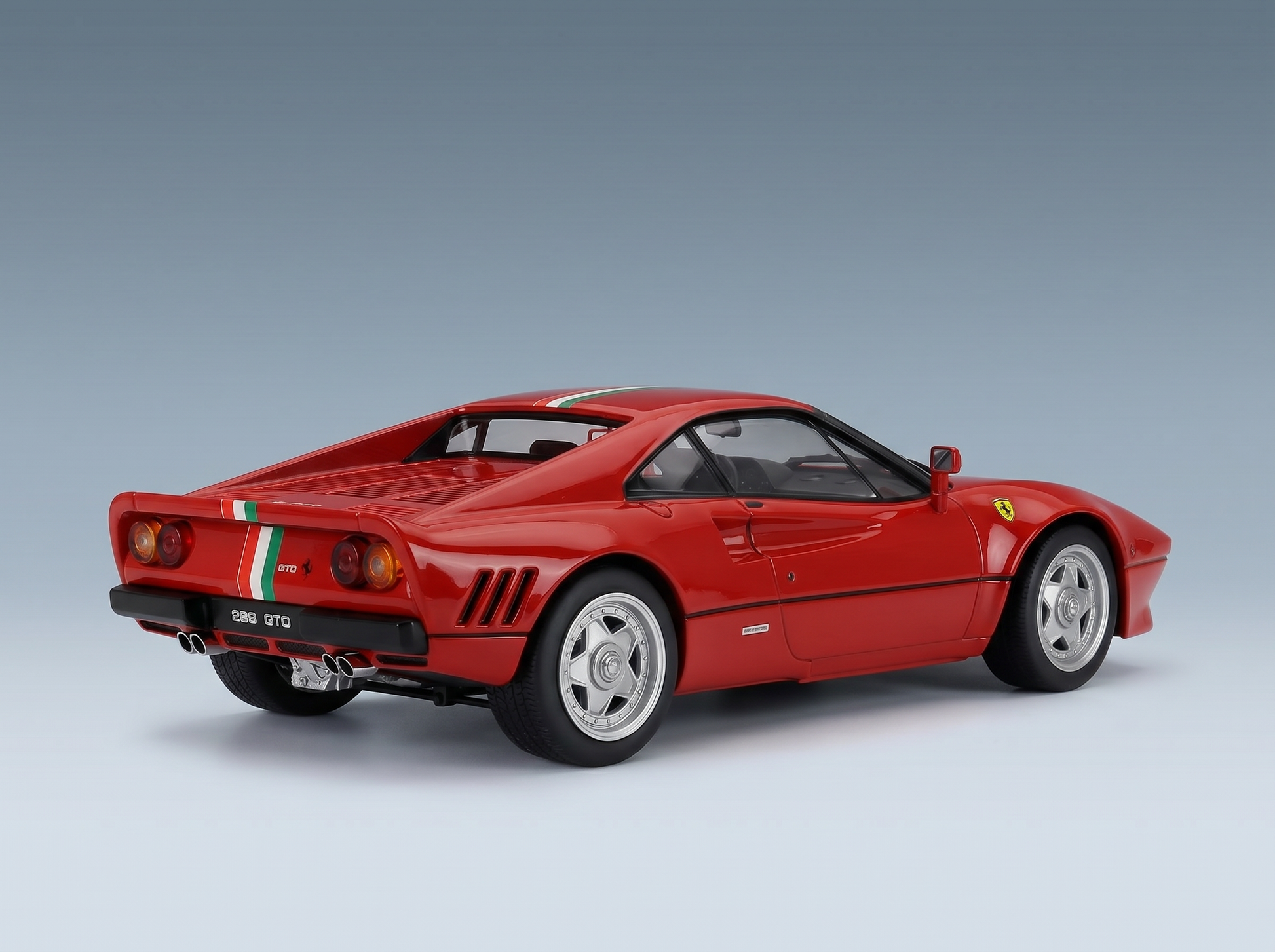 Red Ferrari 288 GTO scale model car with Italian stripes, showcased by Vroomi for collectors.