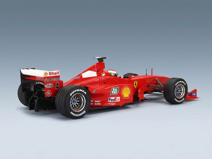 Maquette de voiture de Formule 1 Ferrari rouge arborant les logos Shell, FedEx et Bridgestone, présentée par Vroomi à l'intention des collectionneurs.