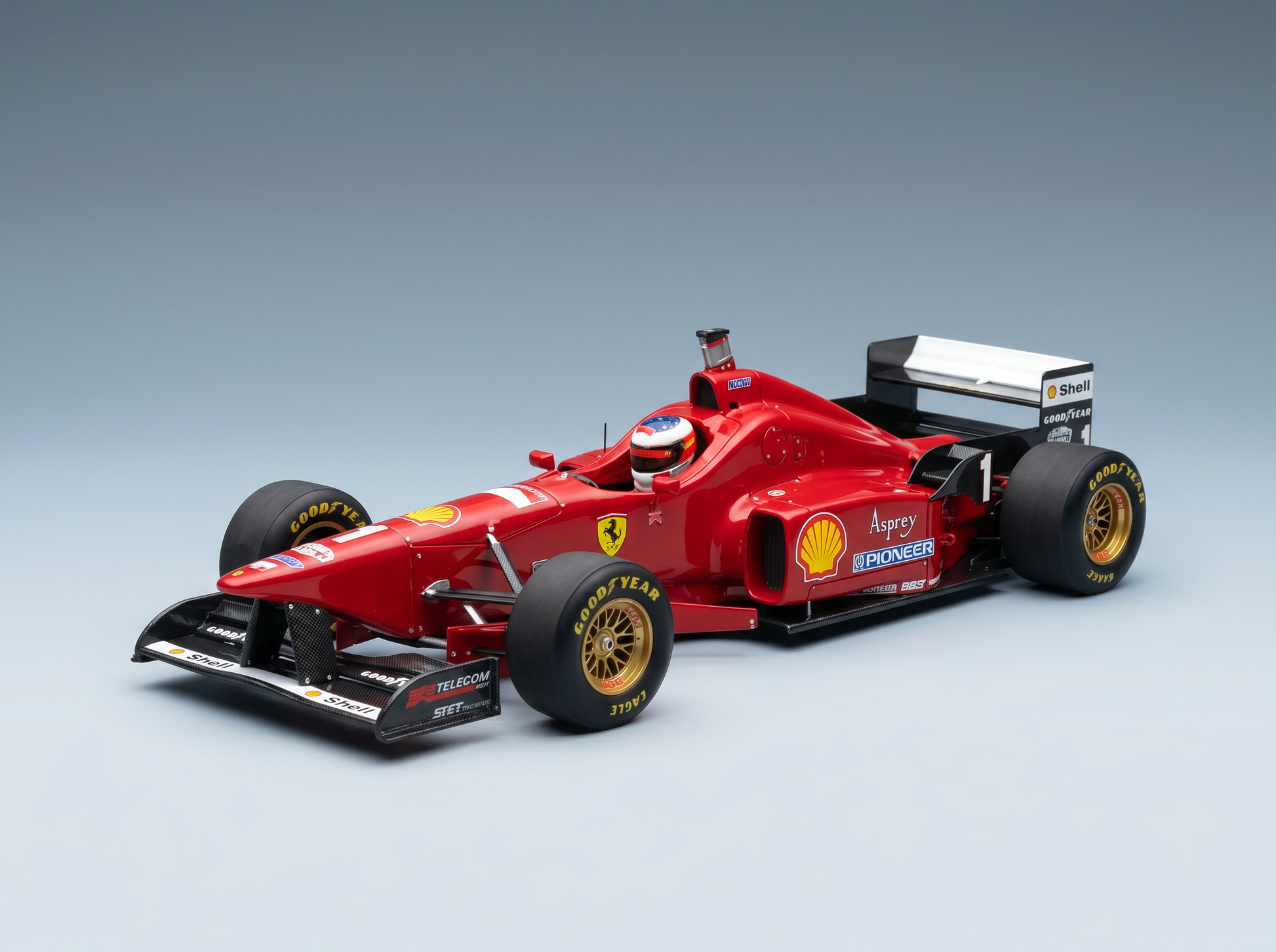 Red Ferrari F1 scale model car with Shell and Goodyear decals, showcased by Vroomi for collectors.