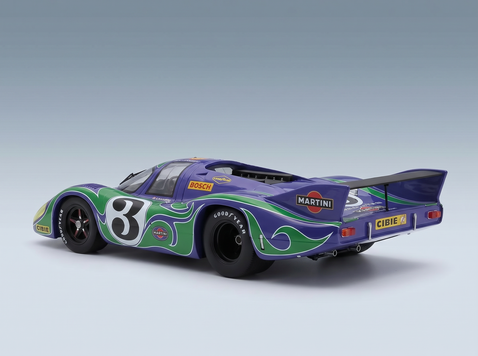 Purple and green Martini-liveried scale model car with number 3, featuring Bosch and Goodyear logos, from Vroomi.